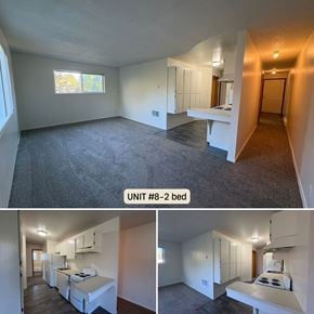 Longview apartment for rent - A bedroom with a bed, a desk, and a window.