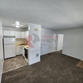 Longview apartment for rent - A room with Rodman Realty Inc. sign on the wall.