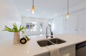 Winnipeg apartment for rent - A kitchen with a white countertop and a sink.