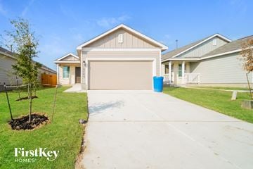 Converse house for rent - a home with a driveway and a garage door