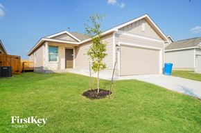Converse house for rent - a home with a small tree in the front yard