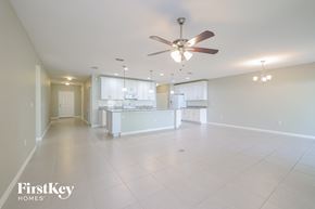 Haines City house for rent - A spacious kitchen and living room with a FirstKey Homes logo.