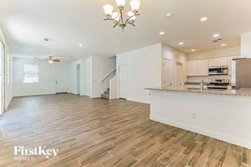 Mesa house for rent - an open kitchen and living room with a counter top and a kitchen island