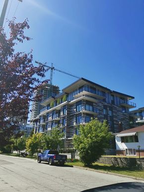 Vancouver apartment for rent - A blue truck is parked on the side of a road.