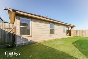 Baytown house for rent - the exterior of a house with stairs and a yard