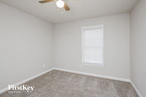 Ball Ground house for rent - the spacious bedroom has carpet and a ceiling fan