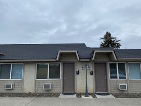 Grandview apartment for rent - A house with a brown door and a grey wall.