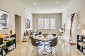 Montgomery apartment for rent - A modern dining room with a glass table and chairs.