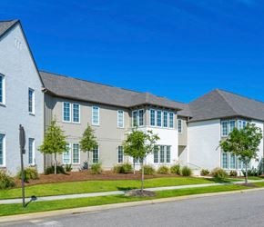 Montgomery apartment for rent - A row of houses with green trees in front.