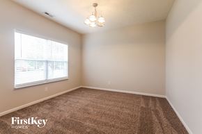Westfield house for rent - A room with a carpeted floor and a window with blinds.