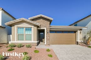 Litchfield Park house for rent - A modern house with a brown garage door and a clear blue sky.