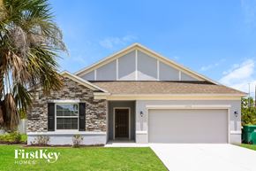 Port Charlotte house for rent - a house with a palm tree in front of it