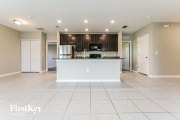 Port Charlotte house for rent - an open kitchen and living room with a white counter top