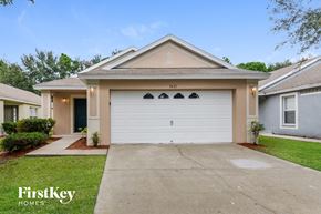 Apollo Beach house for rent - a white garage door in front of a house
