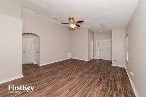 Apollo Beach house for rent - the living room of an empty house with a ceiling fan