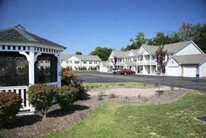 Webster apartment for rent - a row of houses with a street in front of a yard
