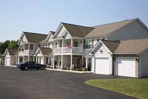 Webster apartment for rent - a large house with a car parked in front of it