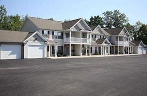 Webster apartment for rent - a row of houses with a parking lot