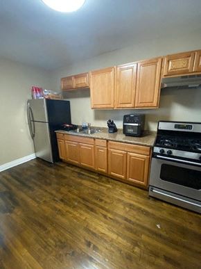 Chicago apartment for rent - a kitchen with a stove and a refrigerator