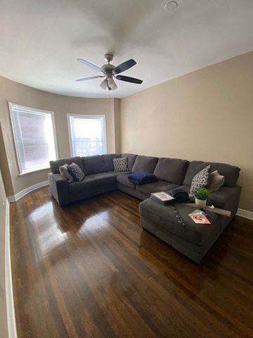 Chicago apartment for rent - a living room with a couch and a ceiling fan