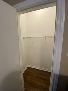 Chicago apartment for rent - a white room with a door open to a closet