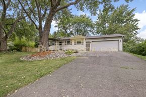 Burnsville house for rent - A residential property with a driveway and a garage.