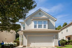Gastonia house for rent - a white house with a white garage door
