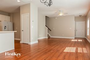 Gastonia house for rent - the living room and dining room of an empty house