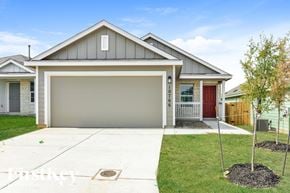 Converse house for rent - A modern house with a grey roof and a red door.