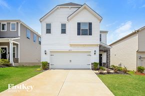 Charlotte house for rent - a white house with a white garage door
