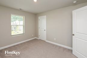 Charlotte house for rent - a bedroom with a white door and a window
