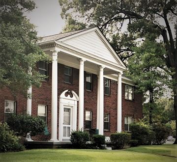 Memphis apartment for rent - the front of a brick house with columns and a white door