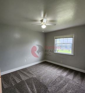 Castle Rock apartment for rent - A room with a carpeted floor and a ceiling fan.