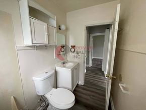 Castle Rock apartment for rent - A white toilet and sink in a small bathroom.