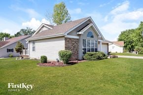 St Charles house for rent - a home with a front yard and grass and a lawn