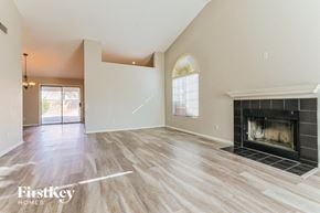 Chandler house for rent - the living room has a fireplace and hardwood floors
