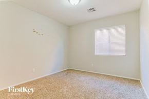 Chandler house for rent - a bedroom with white walls and a window and a carpeted floor