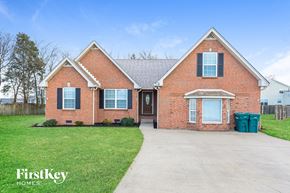 Lebanon house for rent - front view of a brick house with blue shutters and a driveway