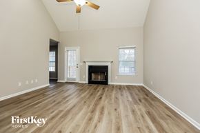 Lebanon house for rent - a living room with a fireplace and wooden floors