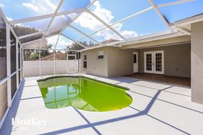 Valrico house for rent - a pool in the middle of a house with a glass roof