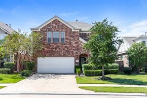 Katy house for rent - A house with a brick facade and a white garage door.