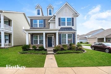 Huntersville house for rent - a white house with blue shutters and a green lawn