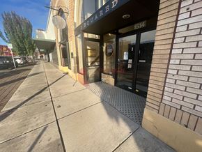 Longview apartment for rent - A storefront with a sign that reads "SQUARED" is visible.