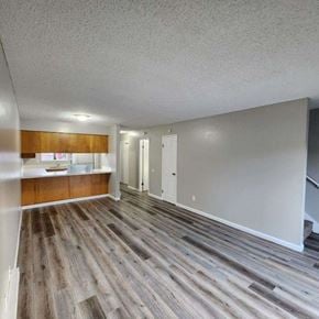 Longview apartment for rent - A room with wooden flooring and white walls.