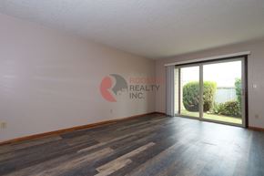 Longview apartment for rent - A room with a wooden floor and a window that is empty and waiting to be filled.