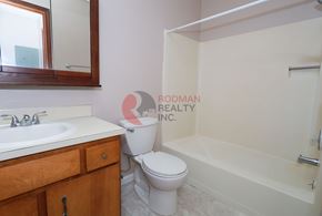 Longview apartment for rent - A bathroom with a toilet, sink, and bathtub.