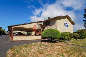 Longview apartment for rent - A building with a blue sign on it.