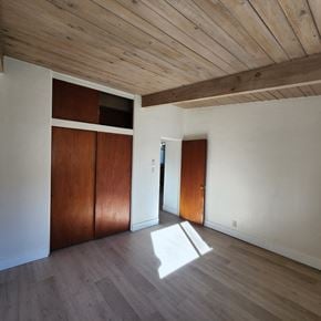 Longview apartment for rent - A room with wooden floors and a wooden ceiling.