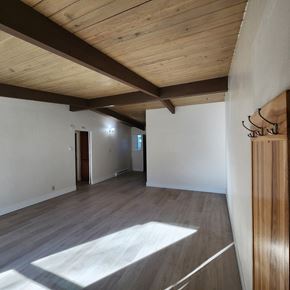 Longview apartment for rent - A room with wooden floors and a wooden ceiling.
