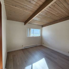 Longview apartment for rent - A room with wooden floors and a window.